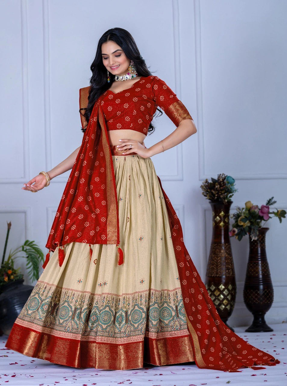 Woman wearing a red and beige traditional outfit with a white background